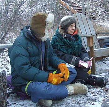 Sangha members Marc and Marie-France practicing the Riwo Sangchod ritual in the far north at Lake Laberge, Yukon in 2006