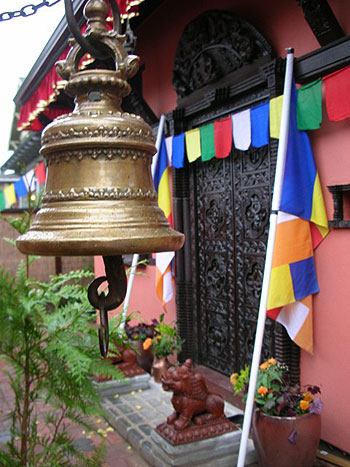 Traditional bell at the new temple's door awaits a visitor’s ring.
