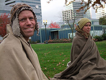 Satya Vahu (left) and Sara Monial  of Touching Earth Sangha sat outdoors during a four-day fast for Climate Justice in downtown Portland in November.