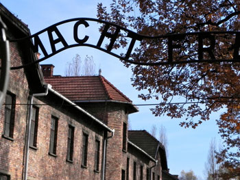 Entrance to Auschwitz. Actually standing in front of the “Arbeit Macht Frei” (“Work Makes One Free”) sign, I felt incredulous. What a profound denial of what took place behind that gate. 
 