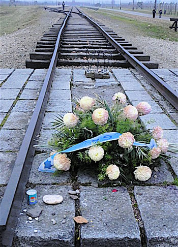 All Saints' Day.We happened to be in Poland for All Saints' Day and All Souls' Day, November 1st and 2nd, when candles and wreaths are placed on grave sites. A wreath was placed by the tracks at Birkenau as well.