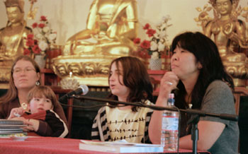 As part of the morning panel on “Family Friendly Sanghas”, Azad Zimmermann (center) speaks about his experiences at Dharma Rain Zen Center's summer camp, Mandala on the Mountain.  At left are Rhiannon Mayes, of Sakya Monastery, and son; on right is Joyce Tsuji of Seattle Betsuin Buddhist Temple.