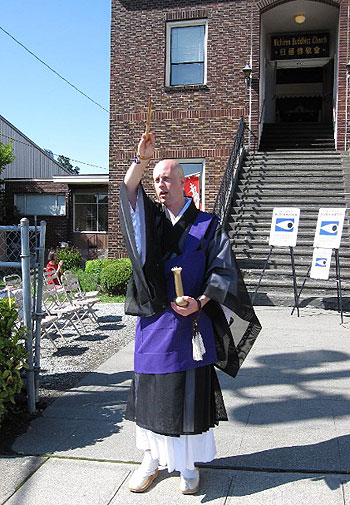 Rev. Kanjin Cederman of Seattle Nichiren contributed a Buddhist blessing to the street.  Rev. Andrew Eng (not shown) from nearby Chinese Southern Baptist Mission read Psalm 121 and offered a prayer.