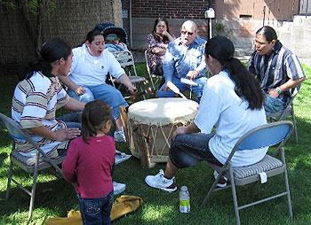 Karl Anquoe and the Coyote Soldier Boys blessed the neighborhood with traditional singing and drumming.