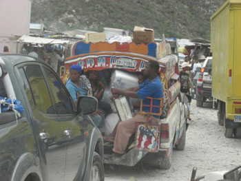 Crossing the border from the Dominican Republic into Haiti. Because of airport and harbor damage in Port-au-Prince much of the supplies entering Haiti must travel a long, mountainous road to reach the capital.