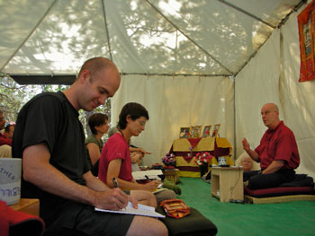 Under a capacious tent, Lama Michael Conklin leads a retreat for Kagyu Changchub Chuling members at Ser Chö Ösel Ling.